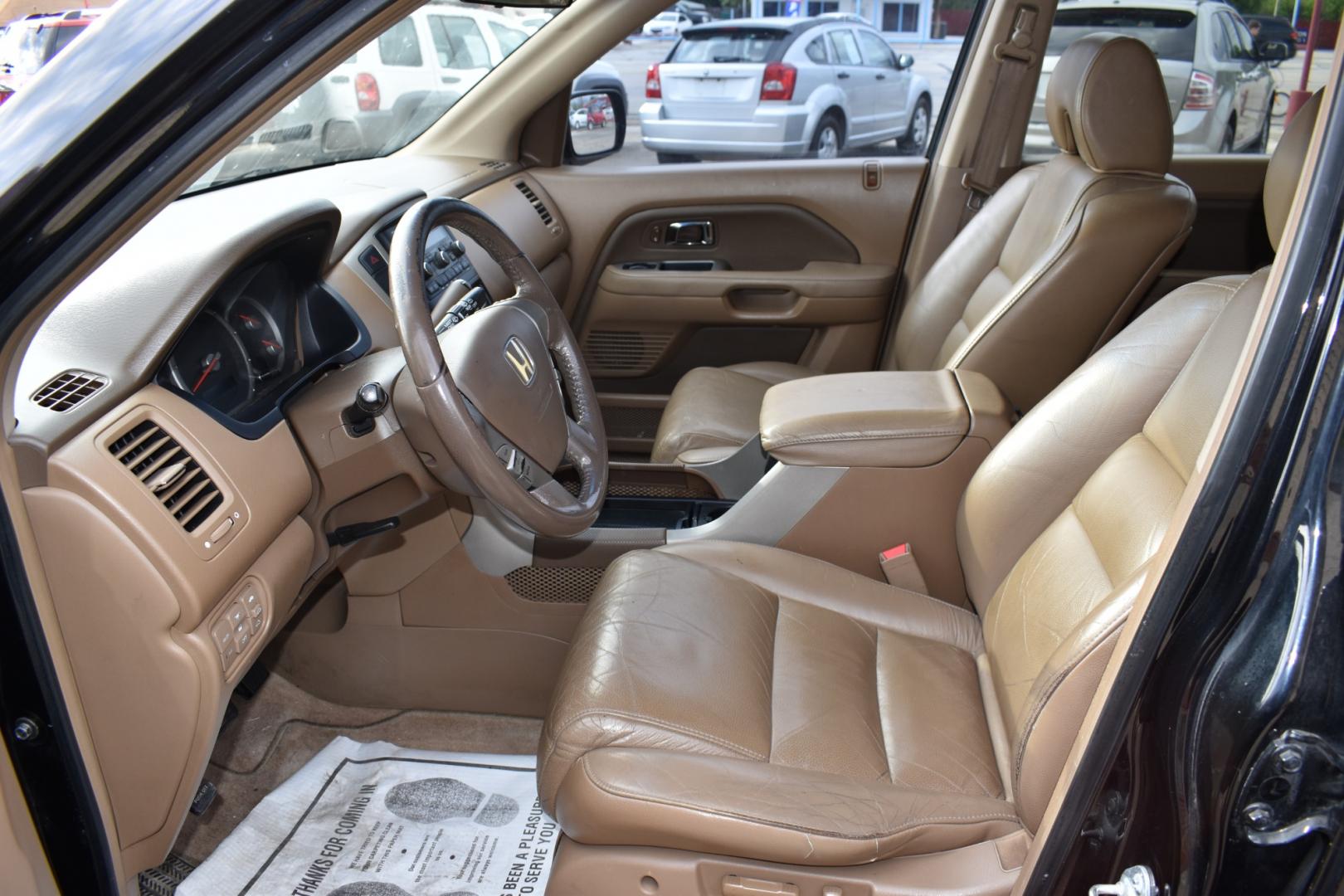 2006 Black /Brown Honda Pilot EX w/ Leather (5FNYF28556B) with an 3.5L V6 SOHC 24V engine, 5-Speed Automatic Overdrive transmission, located at 5925 E. BELKNAP ST., HALTOM CITY, TX, 76117, (817) 834-4222, 32.803799, -97.259003 - Buying a 2006 Honda Pilot EX can offer several benefits, building upon the strengths of its predecessors while incorporating some improvements. Here are some potential advantages: Reliability: Honda has a strong reputation for building reliable vehicles, and the 2006 Pilot is no exception. By 2006, - Photo#7